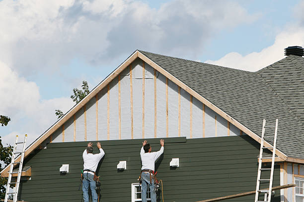 Professional Siding technician working in Harrison, NJ
